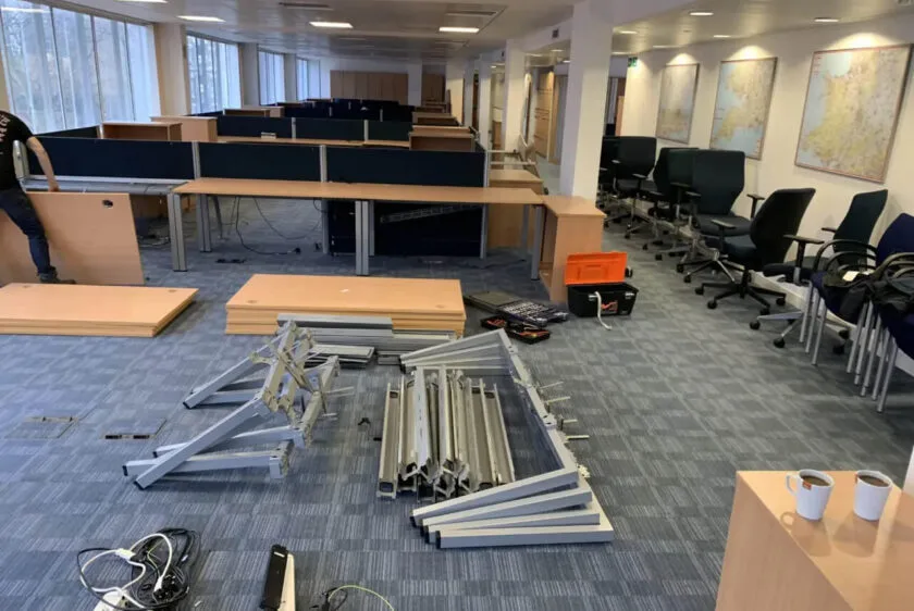 Office furniture being dismantled for clearance